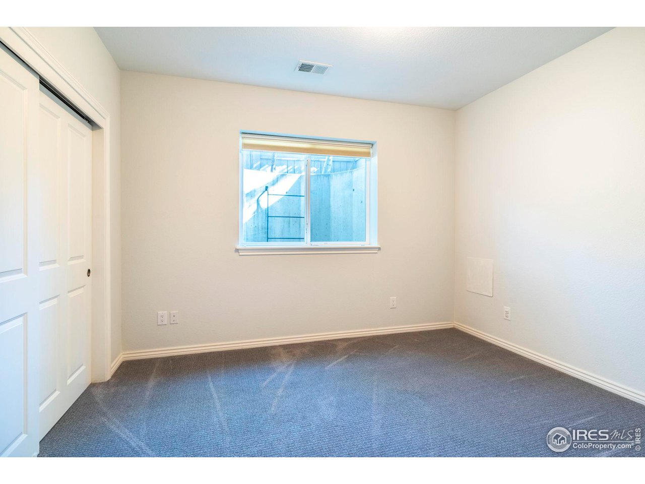 5065 3rd Street Boulder, CO 80304 - Photo 38 of 40 an empty room with wooden floor and windows
