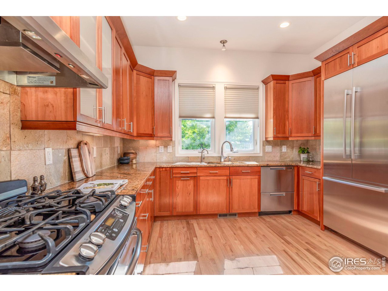 5065 3rd Street Boulder, CO 80304 - Photo 5 of 40 a kitchen with granite countertop a stove and a sink
