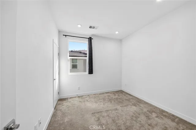 a view of a hallway with washer and dryer