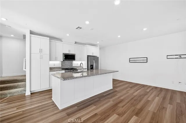 a view of a living room with a flat screen tv