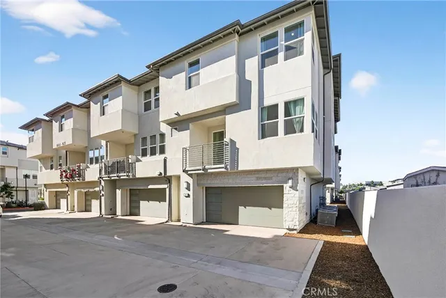 a front view of a house with a garage