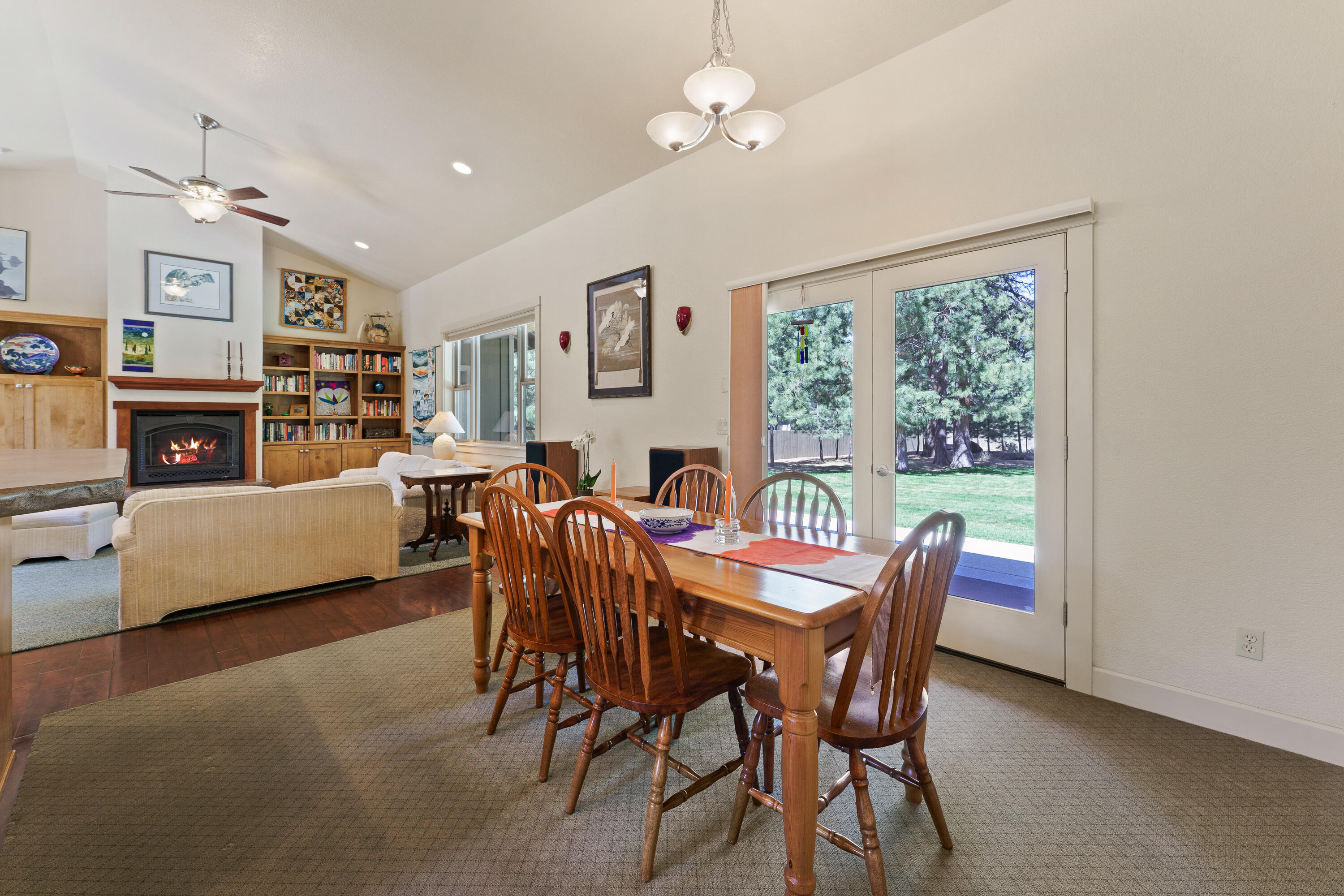 19236 Kiowa Road Bend, OR 97702 - Photo 14 of 52 a view of a dining room with furniture window and wooden floor