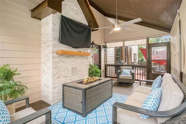 a view of entryway with furniture and wooden floor