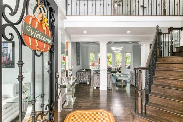 a living room with wooden floor and furniture