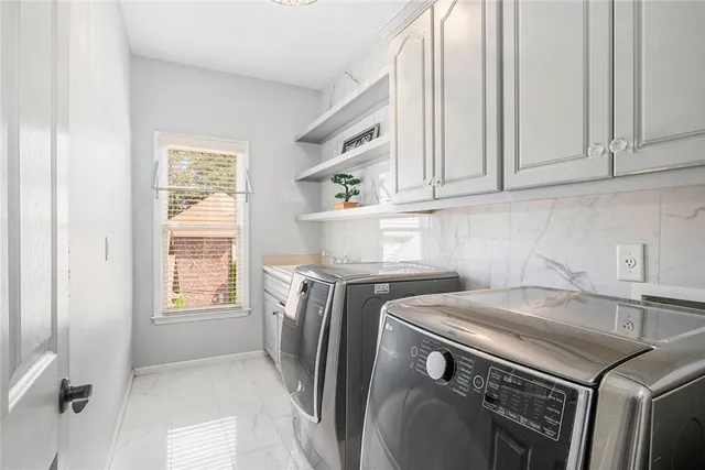 a bathroom with a granite countertop sink mirror and shower