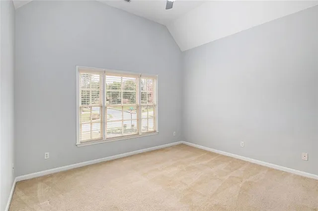 a kitchen with stainless steel appliances granite countertop a sink and dishwasher a refrigerator with wooden cabinets