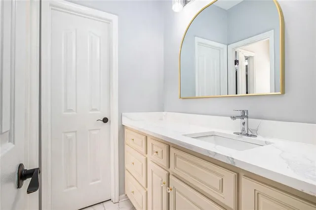 a kitchen with stainless steel appliances a stove a sink and a refrigerator