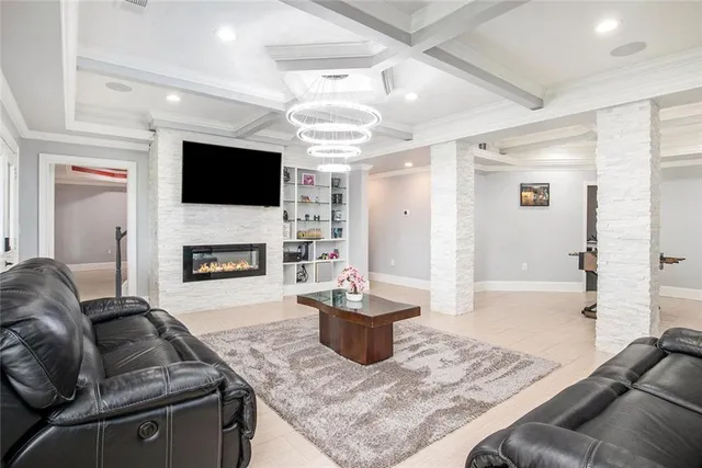 a living room with furniture and a baby