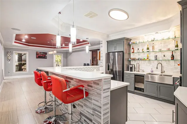a bathroom with a double vanity sink mirror and shower