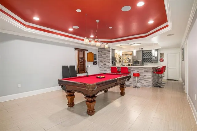 a view of a house with a yard and sitting area