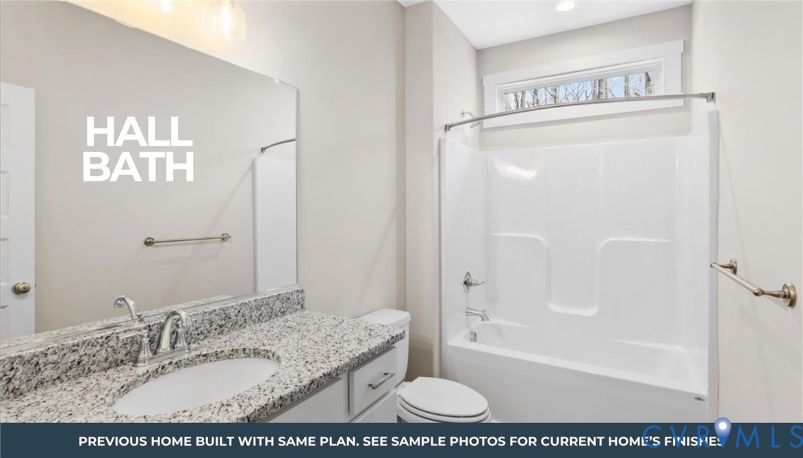 3530 Red Hill Road Gordonsville, VA 22942 - Photo 6 of 8 a bathroom with a granite countertop sink a mirror and a bathtub