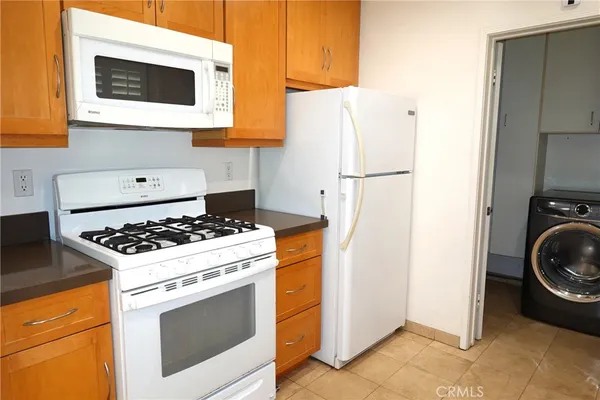a kitchen with a stove and a refrigerator