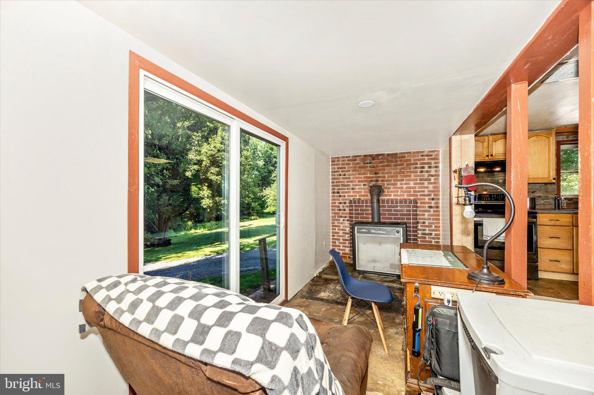 14721 Albert Staub Road Thurmont, MD 21788 - Photo 19 of 46 a bedroom with a bed and large window