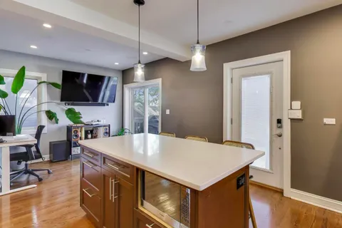 a kitchen with a table and chairs in it