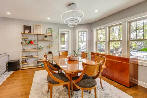 a view of a dining room with furniture window and outside view