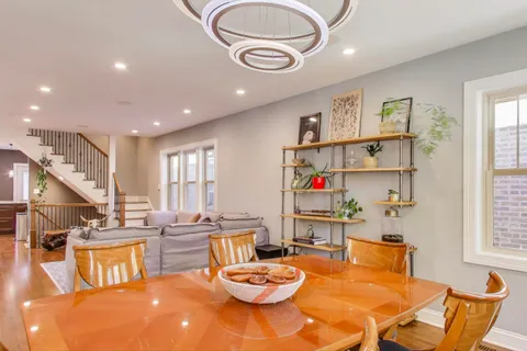 a living room with furniture a rug and a window