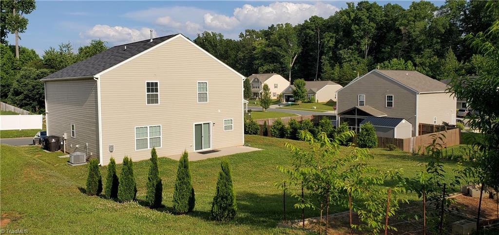 1906 Longshadow Street Rural Hall, NC 27045 - Photo 4 of 23 Rear Elevation and Back Yard