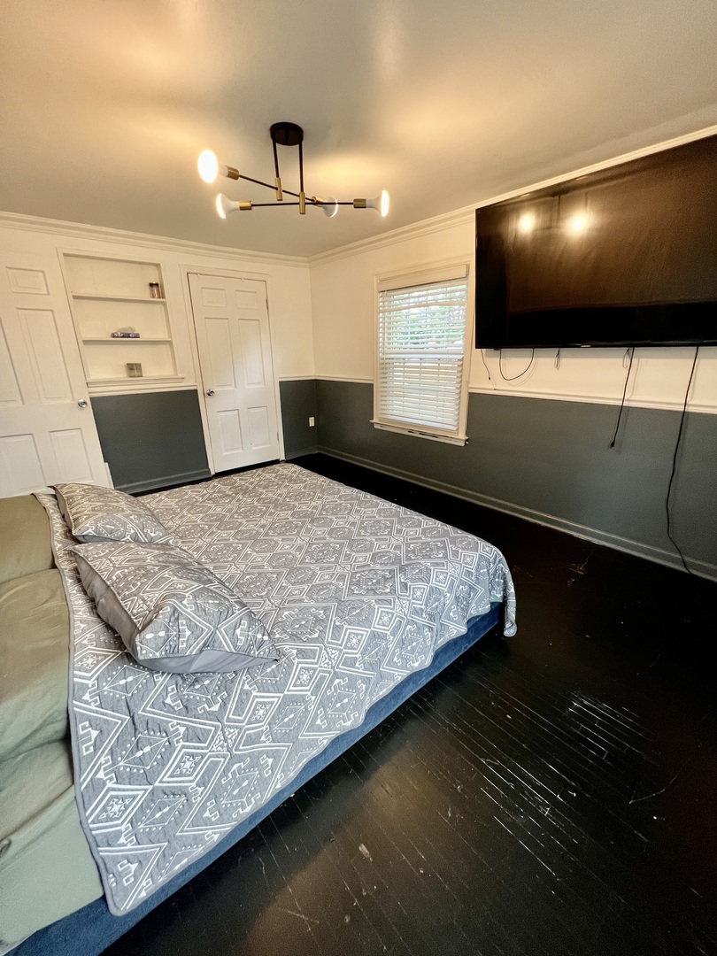 564 Mann Place Elgin, IL 60120 - Photo 13 of 28 a bed sitting in a room next to a large window
