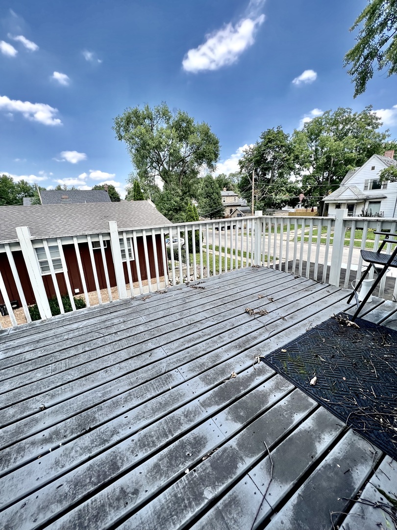564 Mann Place Elgin, IL 60120 - Photo 19 of 28 a view of a wooden deck
