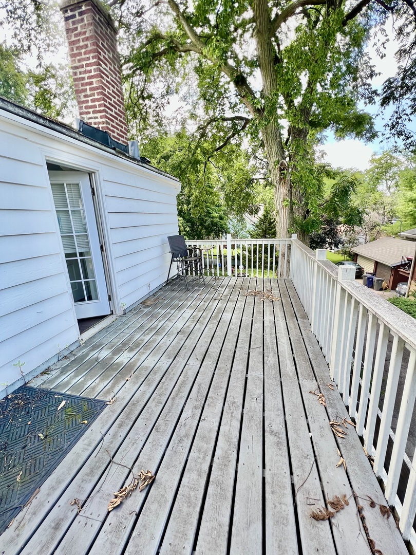 564 Mann Place Elgin, IL 60120 - Photo 28 of 28 a view of balcony with wooden floor and fence