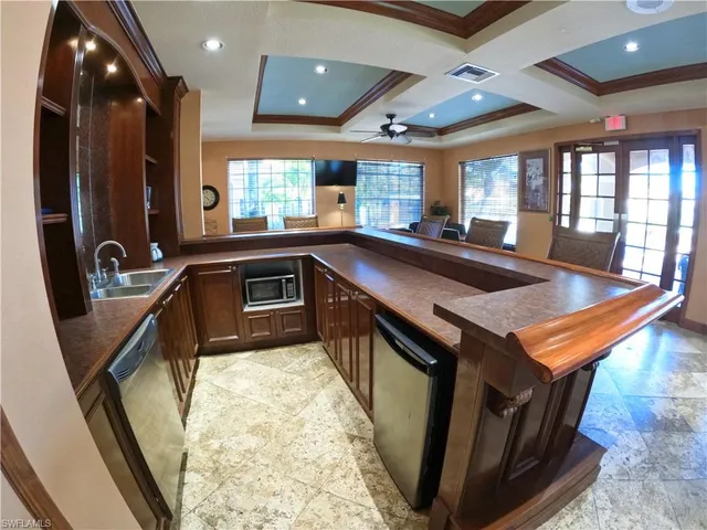 a living room with lots of furniture and a rug