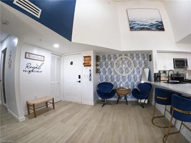 a living room with furniture and a chair