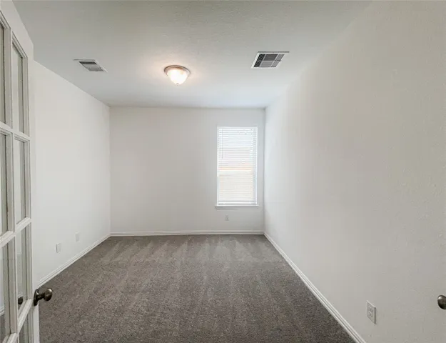 a living room with furniture kitchen view and a potted plant