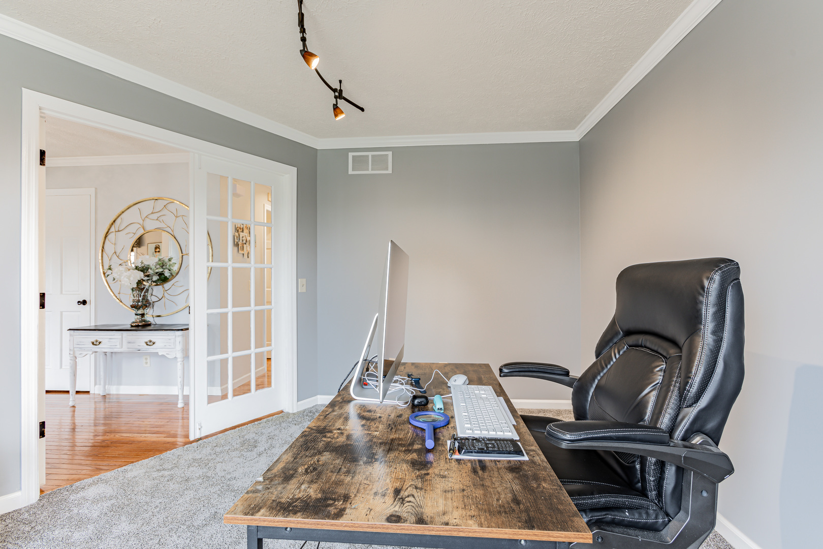 4401 Copper Ridge Road Champaign, IL 61822 - Photo 15 of 49 a view of a workspace with furniture and wooden floor