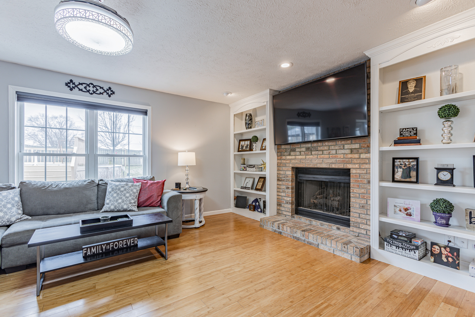 4401 Copper Ridge Road Champaign, IL 61822 - Photo 17 of 49 a living room with furniture and a fireplace