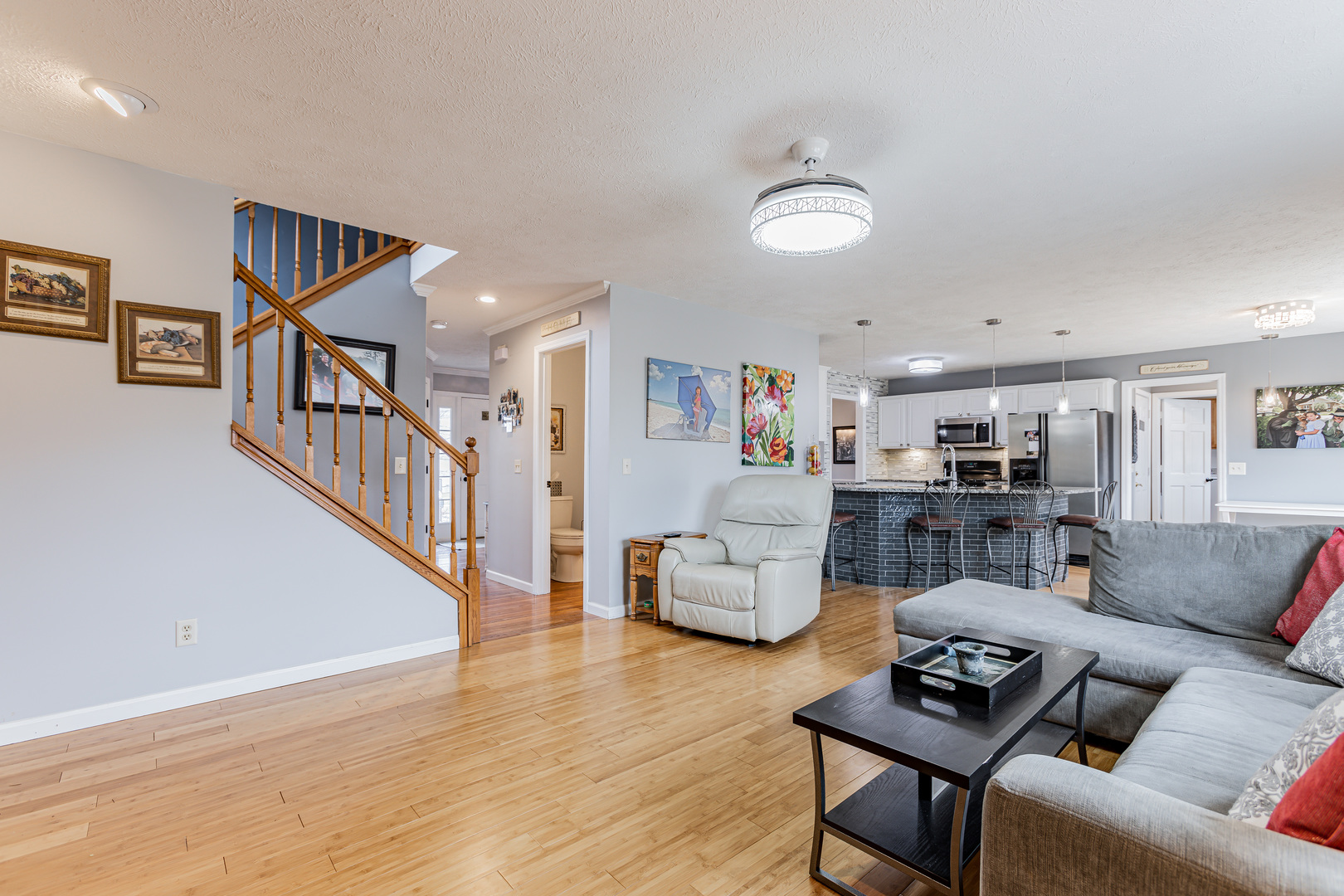 4401 Copper Ridge Road Champaign, IL 61822 - Photo 19 of 49 a living room with furniture and stairs