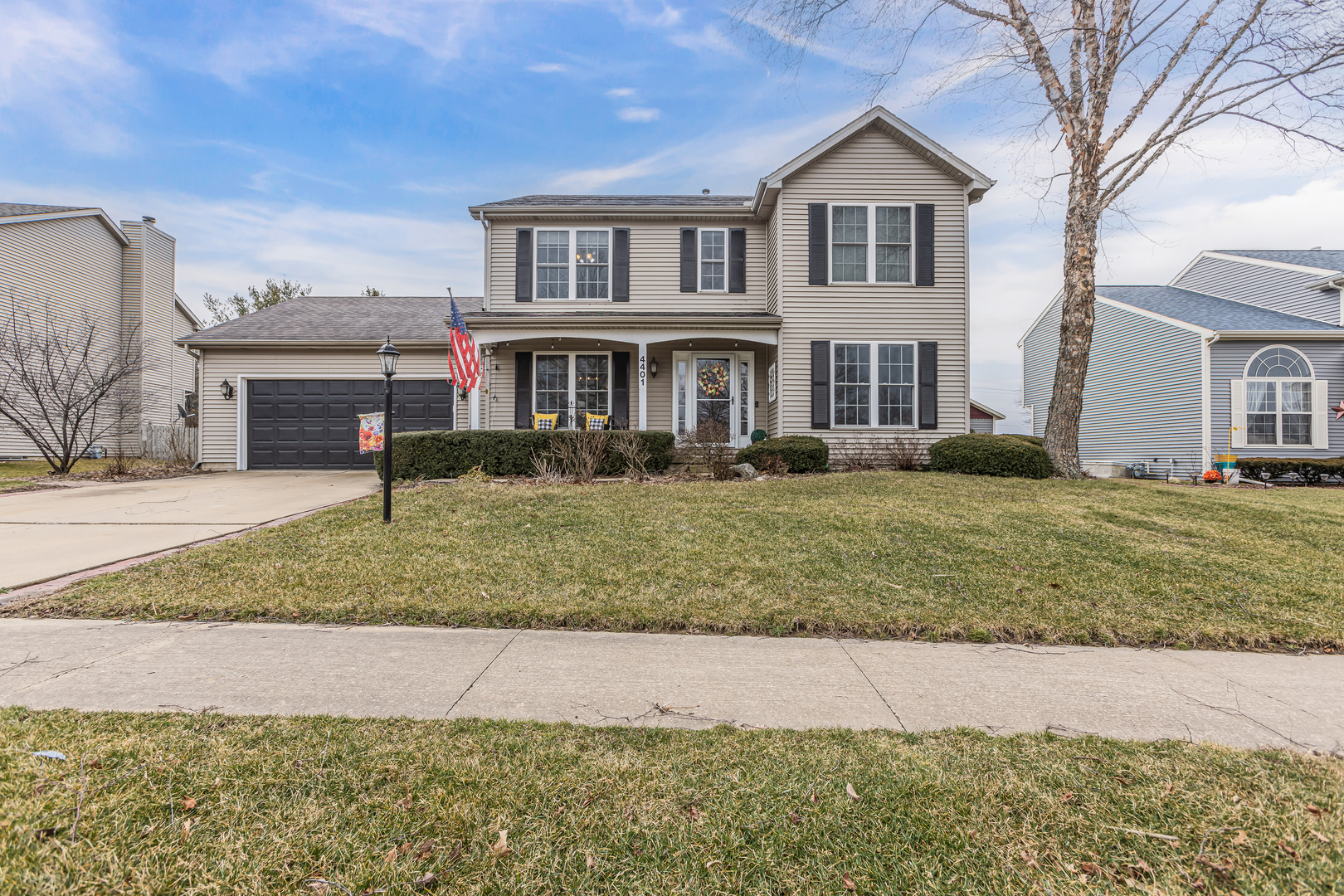 4401 Copper Ridge Road Champaign, IL 61822 - Photo 2 of 49 a front view of a house with a yard