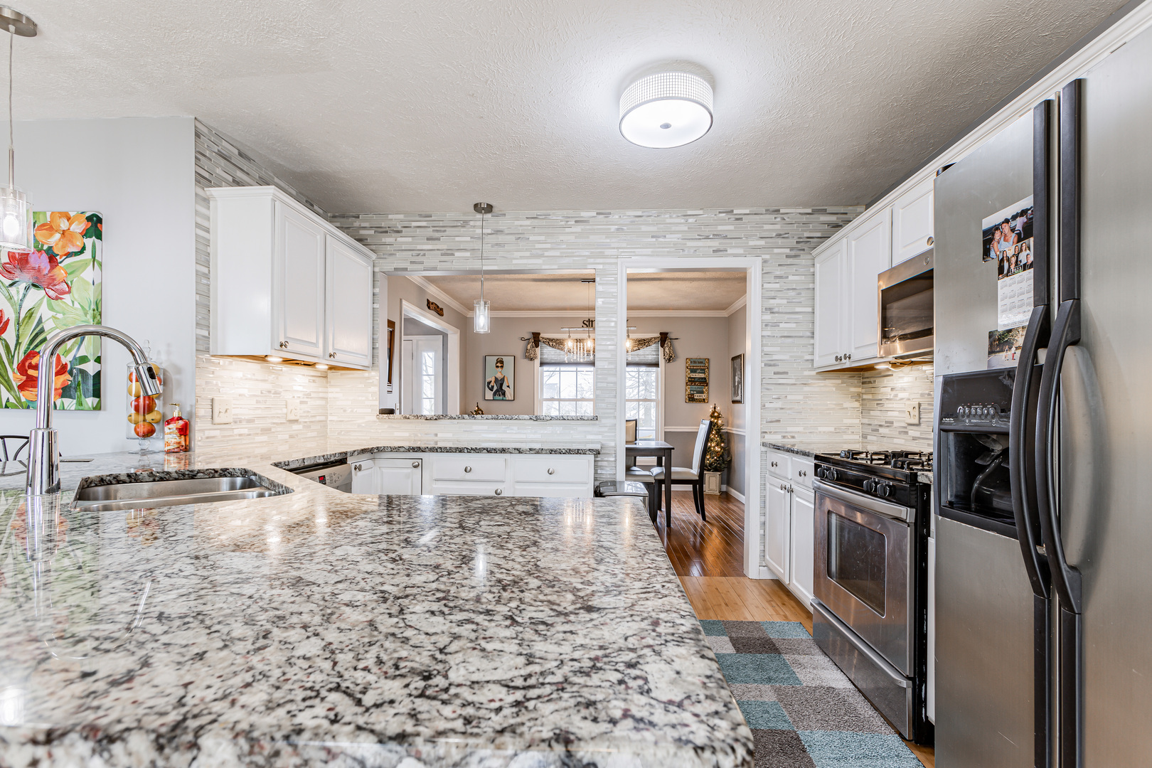 4401 Copper Ridge Road Champaign, IL 61822 - Photo 22 of 49 a kitchen with stainless steel appliances granite countertop a stove a sink and a refrigerator
