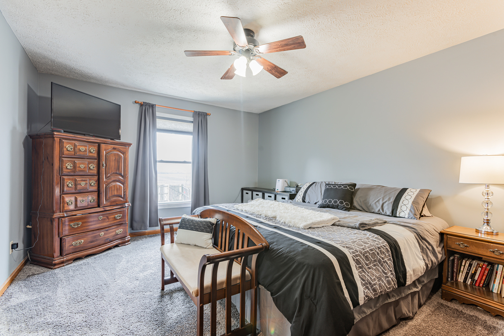 4401 Copper Ridge Road Champaign, IL 61822 - Photo 29 of 49 a bed sitting in a bedroom next to a window