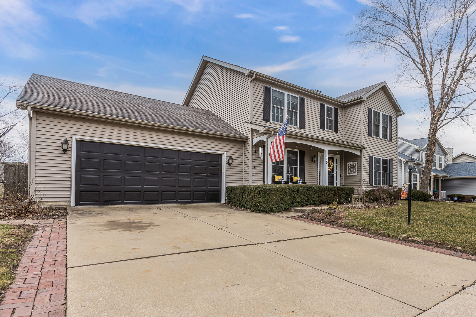 4401 Copper Ridge Road Champaign, IL 61822 - Photo 3 of 49 a front view of a house with garden