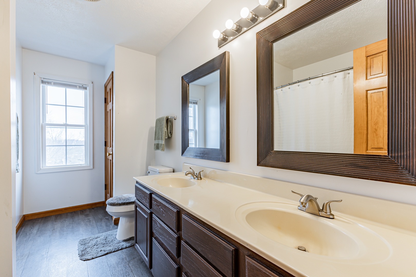 4401 Copper Ridge Road Champaign, IL 61822 - Photo 32 of 49 a bathroom with 2 sink and a mirror