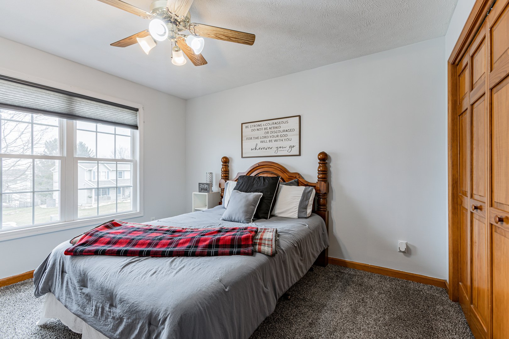 4401 Copper Ridge Road Champaign, IL 61822 - Photo 36 of 49 a bedroom with a bed and a chandelier