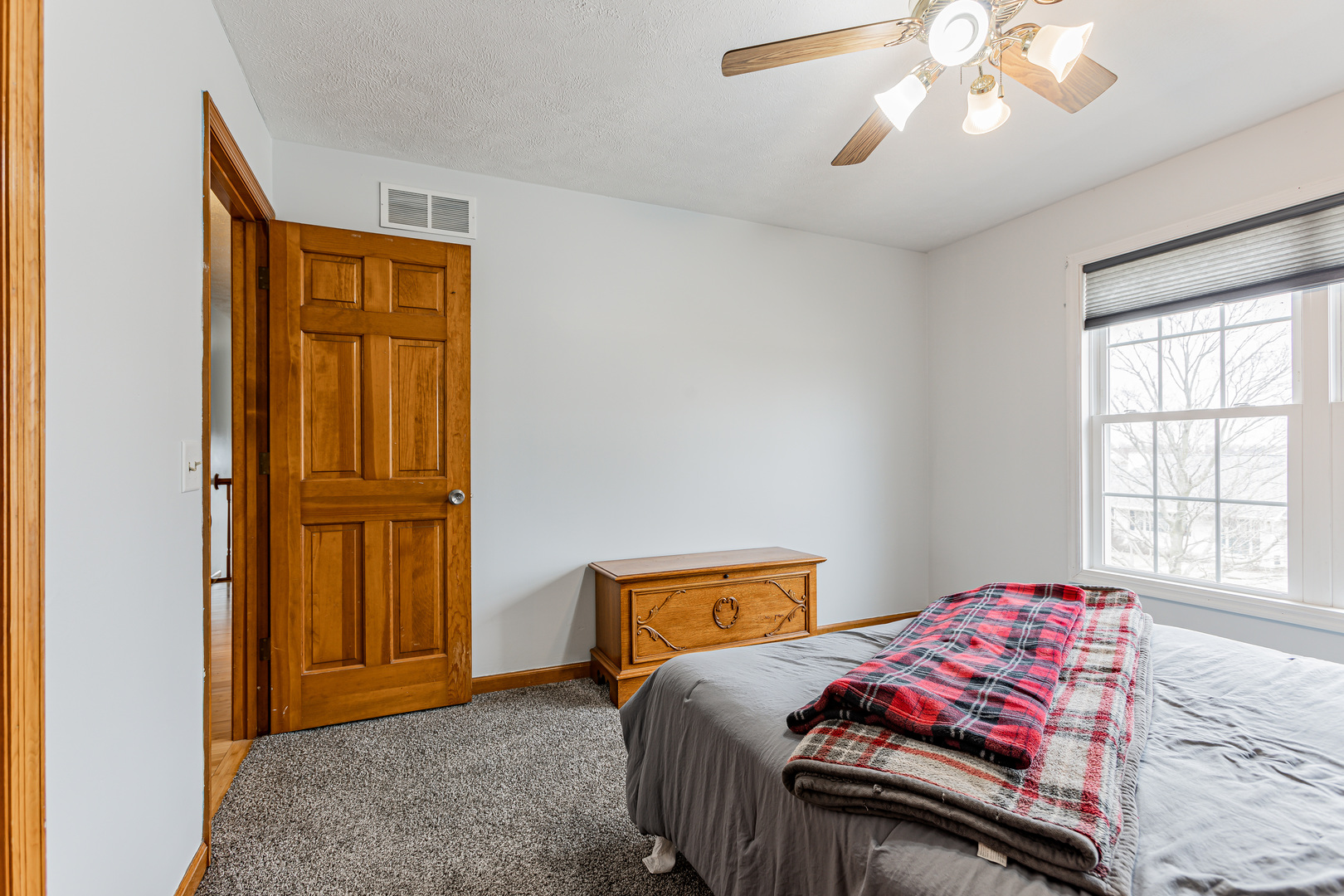 4401 Copper Ridge Road Champaign, IL 61822 - Photo 37 of 49 a bedroom with a bed and a window
