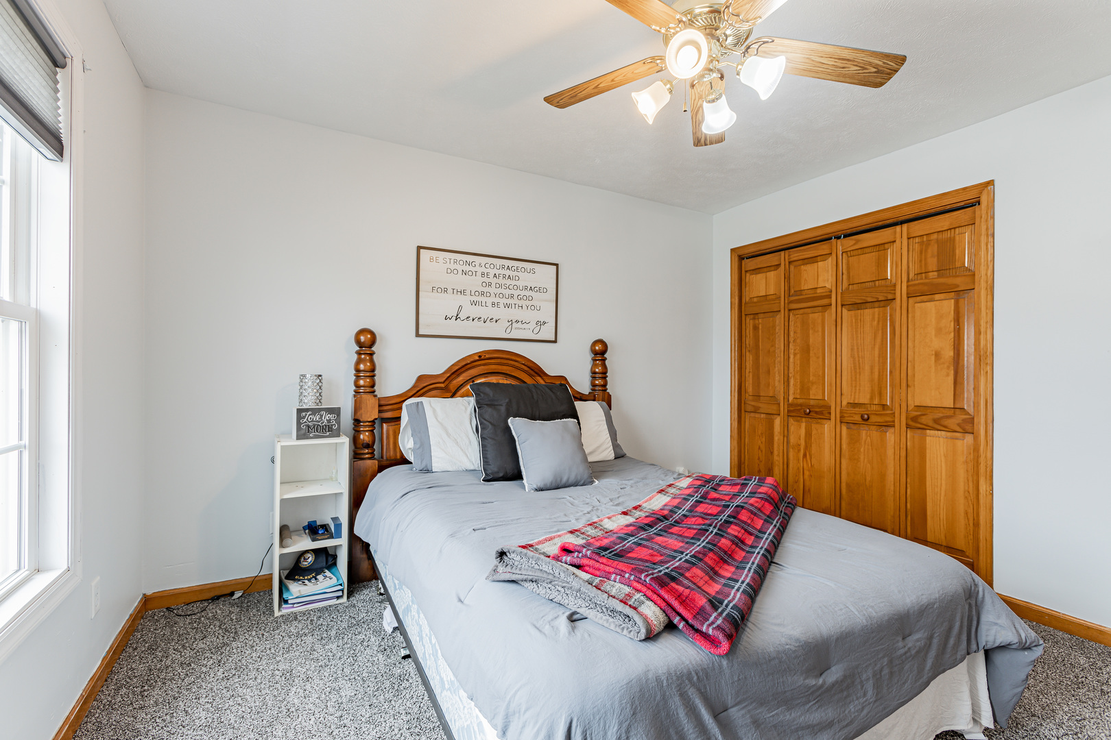 4401 Copper Ridge Road Champaign, IL 61822 - Photo 38 of 49 a bedroom with a bed and a chandelier