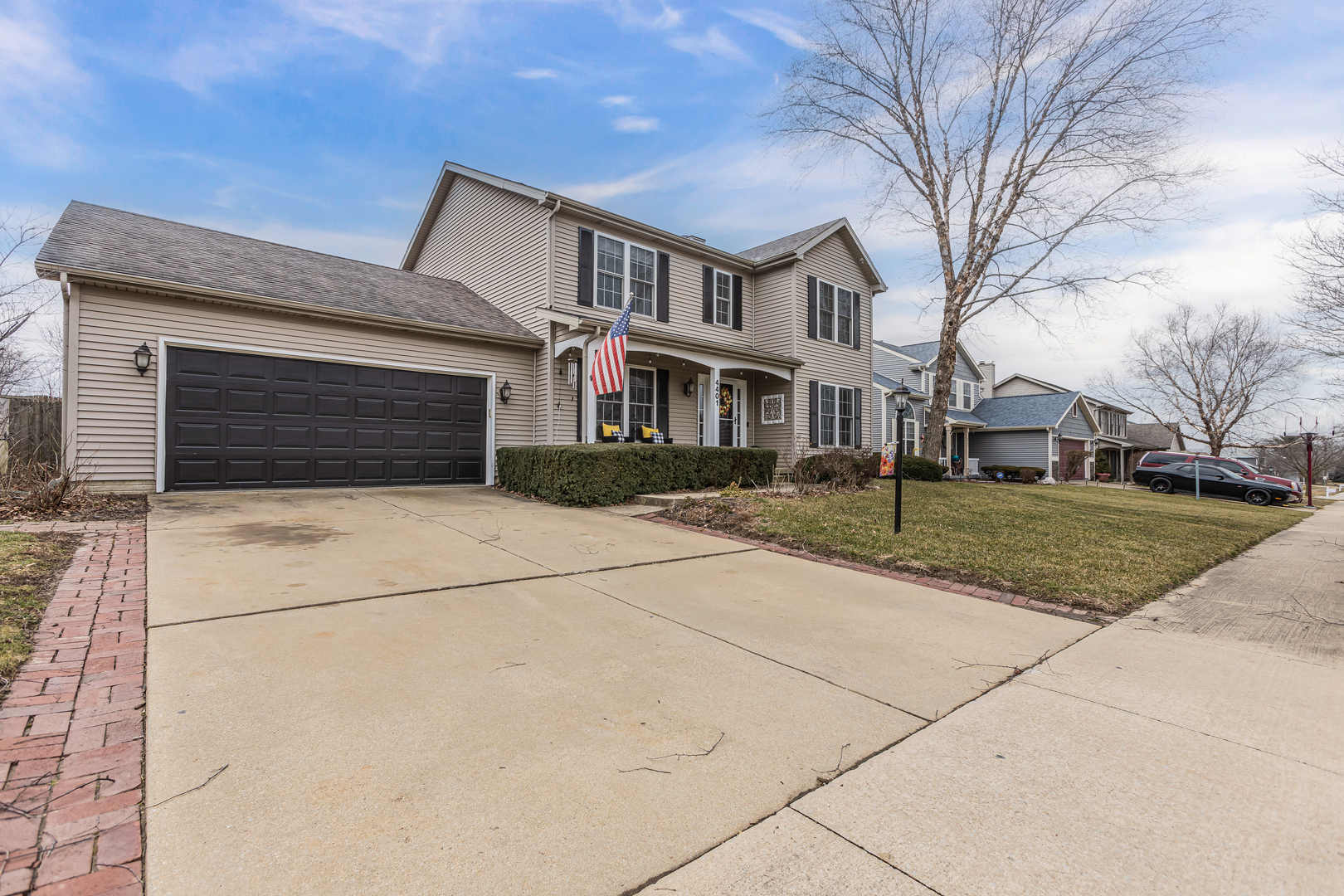 4401 Copper Ridge Road Champaign, IL 61822 - Photo 4 of 49 a front view of a house with a yard