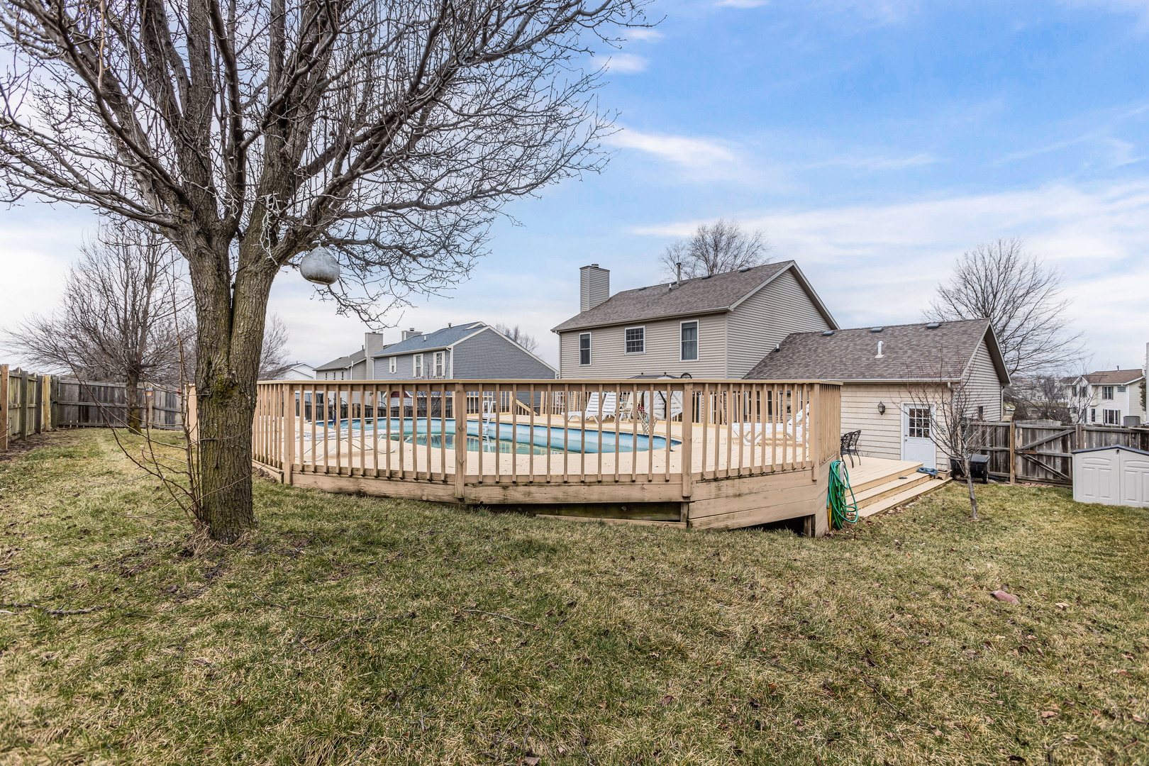 4401 Copper Ridge Road Champaign, IL 61822 - Photo 41 of 49 a view of a house with a yard porch and wooden fence