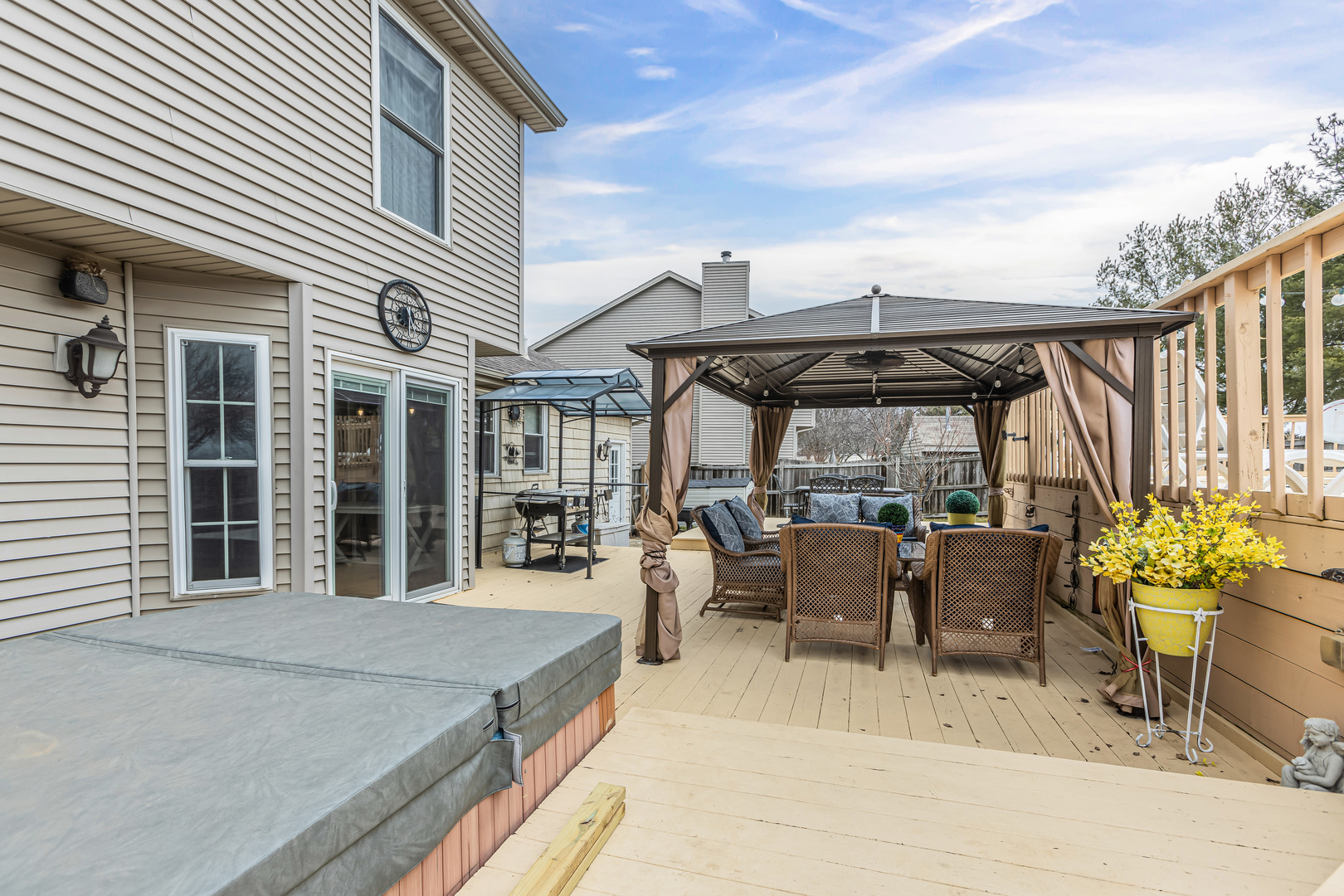 4401 Copper Ridge Road Champaign, IL 61822 - Photo 44 of 49 a view of a patio with couches table and chairs and potted plants