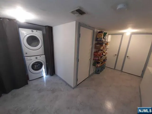 a view of a hallway with washer and dryer