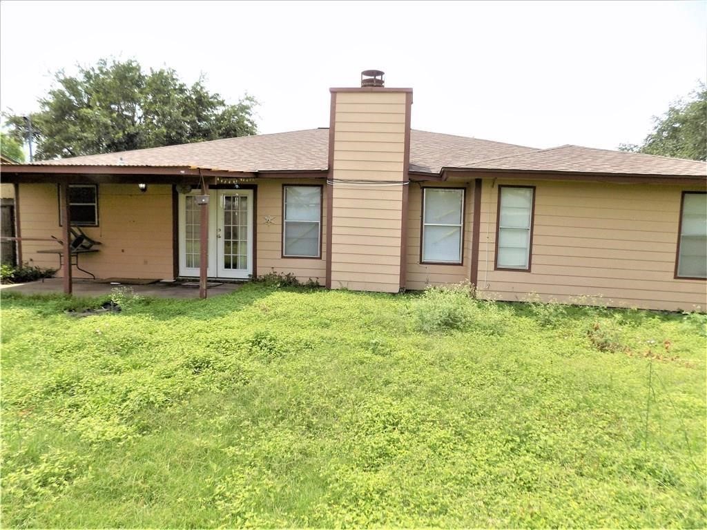 4106 Rippling Creek Drive Corpus Christi, TX 78410 - Photo 22 of 22 a brick house with a large windows