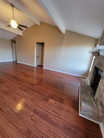 a view of a livingroom with wooden floor