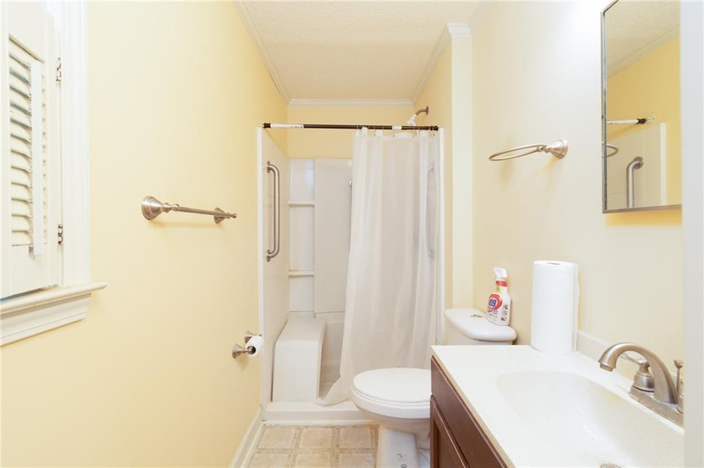 6533 Monnett Road Climax, NC 27233 - Photo 11 of 13 a bathroom with a sink toilet and shower