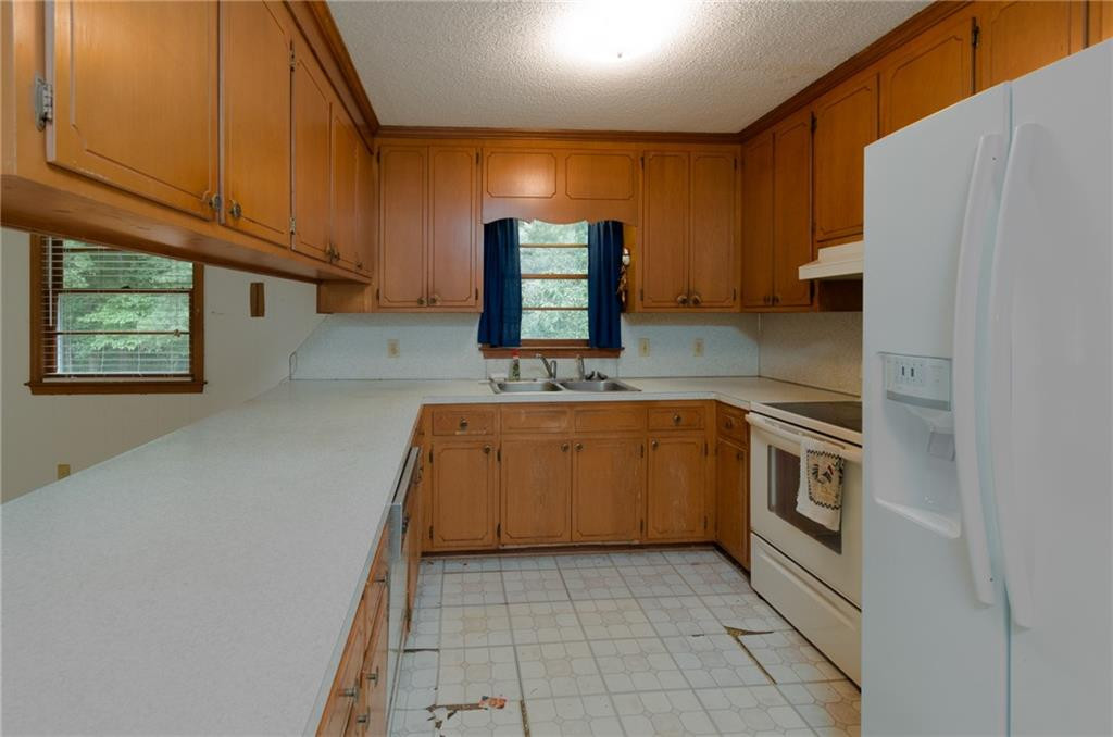 6533 Monnett Road Climax, NC 27233 - Photo 6 of 13 a kitchen with a sink cabinets and window