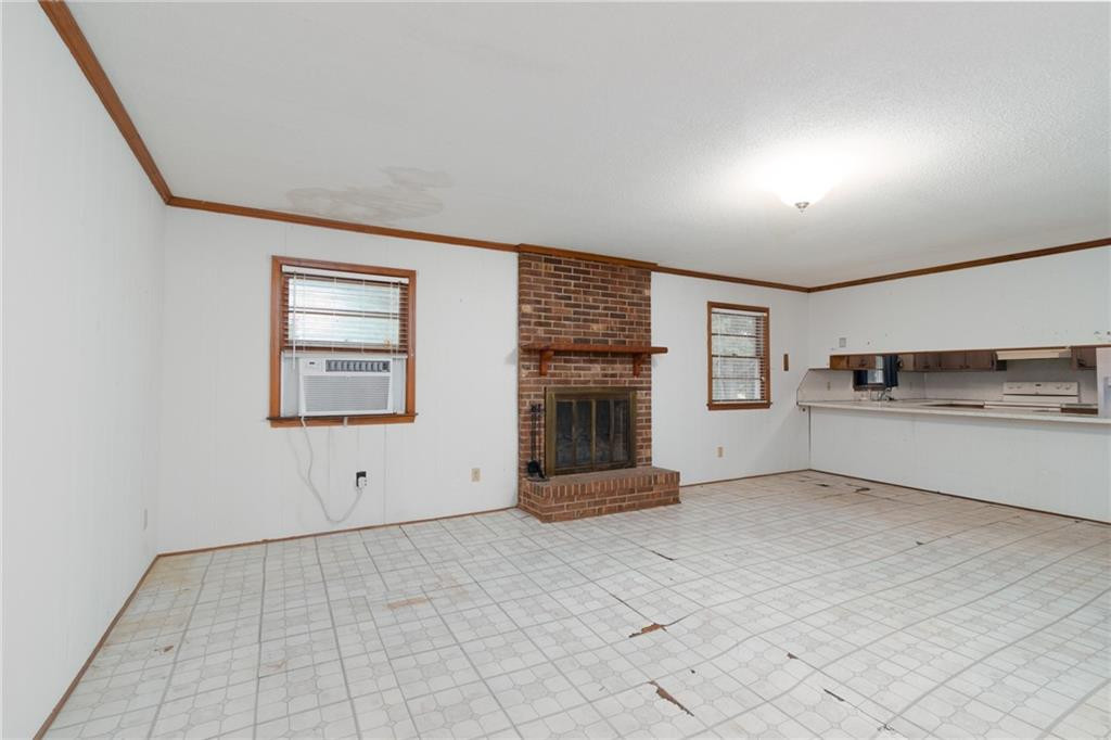 6533 Monnett Road Climax, NC 27233 - Photo 8 of 13 a view of a kitchen with a sink cabinets and a window