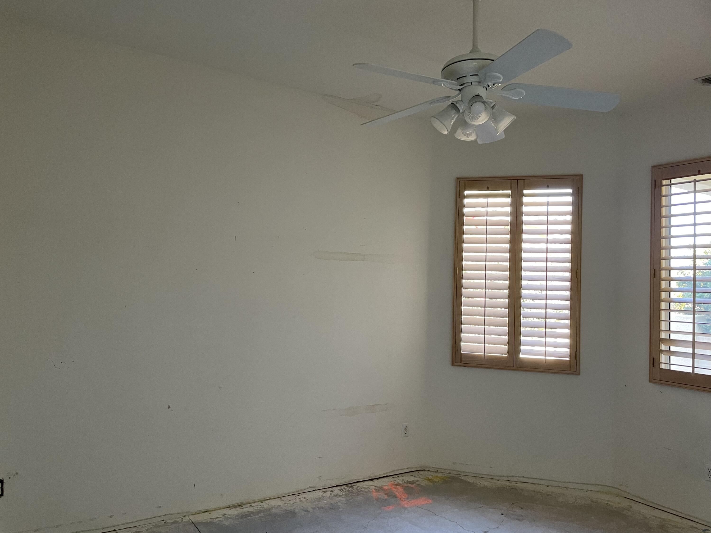 3 King Edward Court Rancho Mirage, CA 92270 - Photo 13 of 20 an empty room with windows and fan
