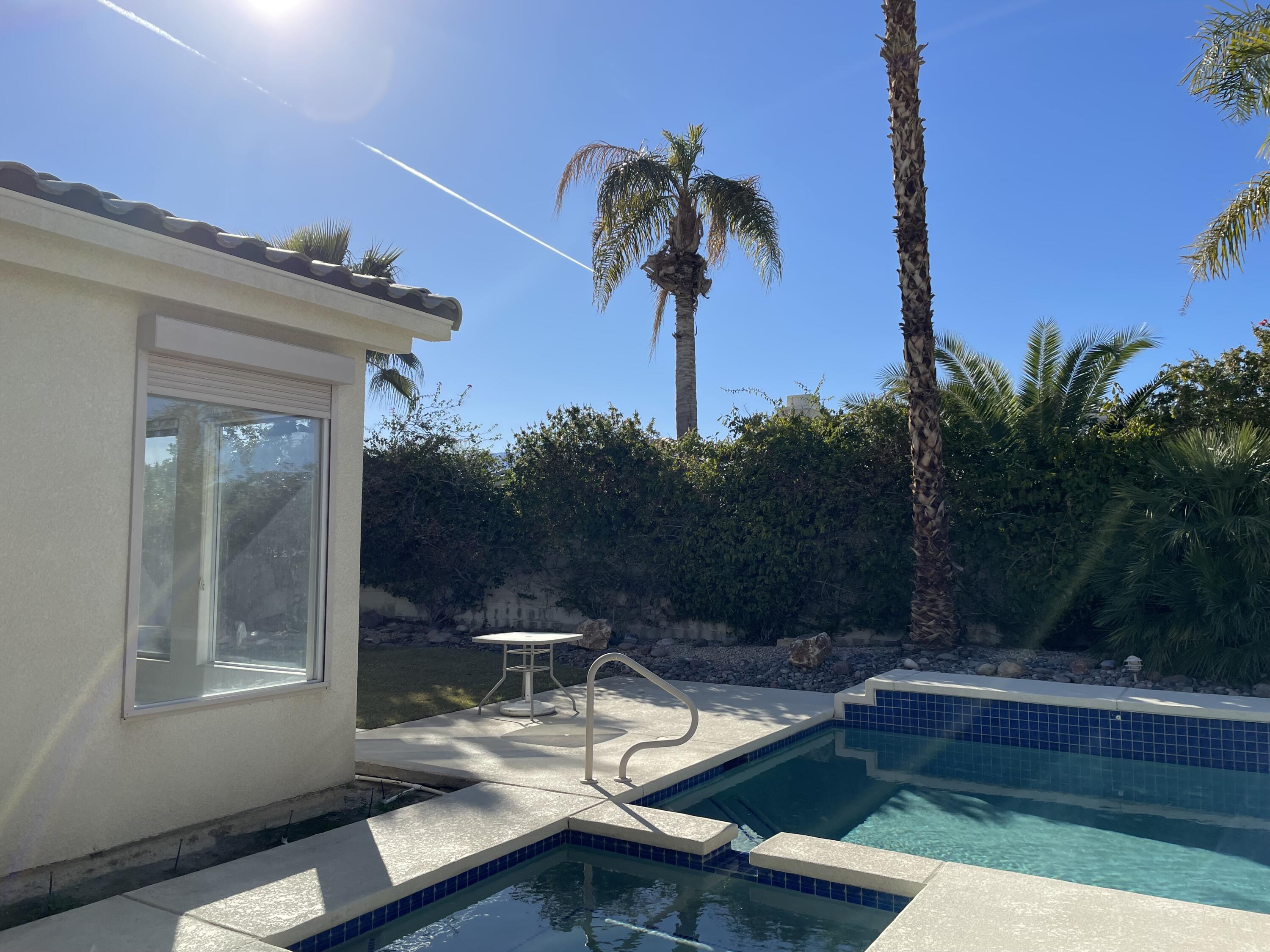 3 King Edward Court Rancho Mirage, CA 92270 - Photo 20 of 20 a view of a house with pool and sitting area
