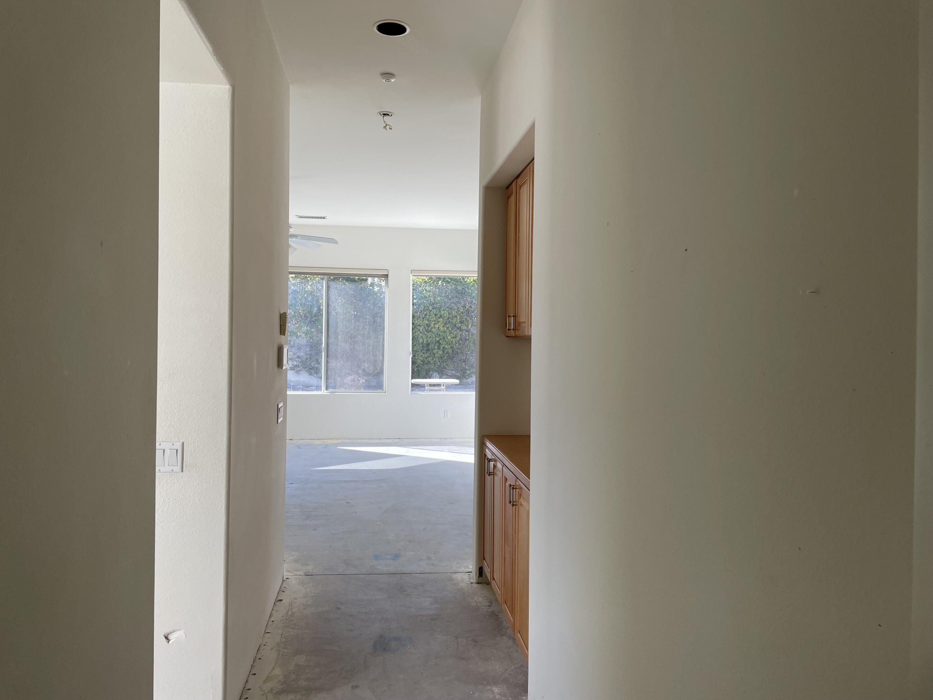 3 King Edward Court Rancho Mirage, CA 92270 - Photo 9 of 20 a view of a bathroom from a hallway